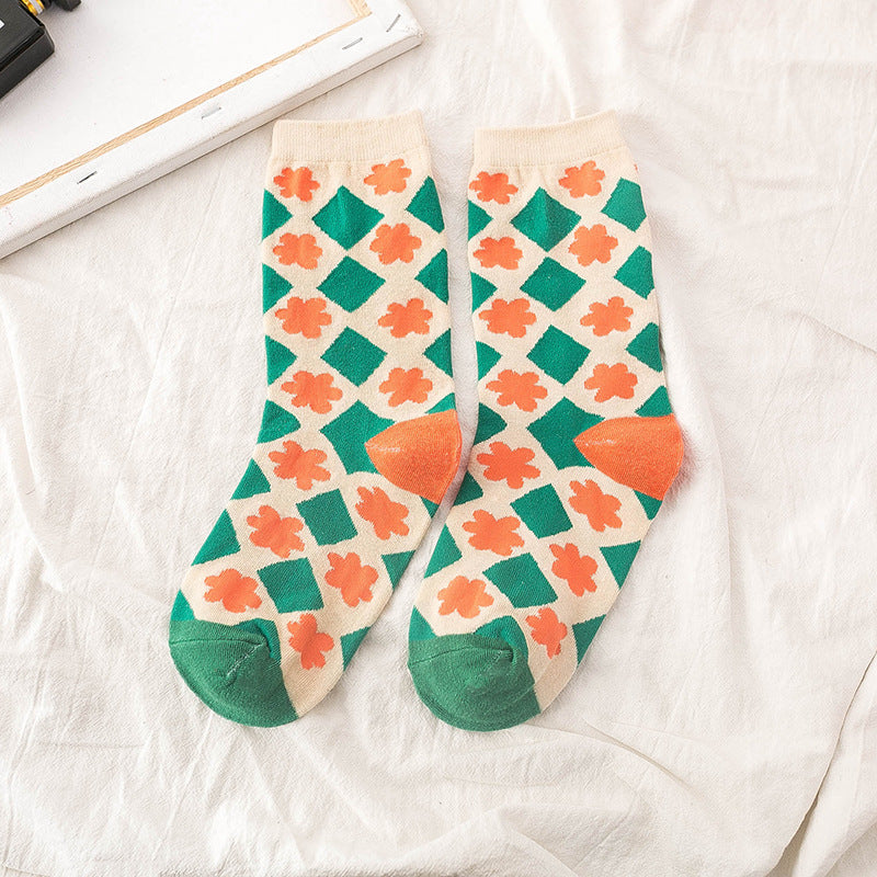 JoyPop Patterned Socks in green with orange flowers  front picture